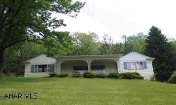 Ranch hilltop home with view-accented charm. Large yard, covered front porch, flagstone patio, 2 fireplaces, hardwood flooring and carpeting. Tax ID # F9 E3-2, F9 E3-3 and E9 D3-17