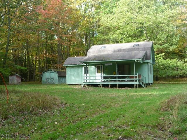 Private camp where you can get ready for the hunt or just relax with friends and family.  Cabin with kitchen / living room and bath on first floor.  Second floor is an open bedroom area.  Set on approximately two mostly wooded acres.  There is a well but city water is available to connect to as the tap has been paid.  Septic tank.  Electricity.  Heat is electric hot air along with a combination wood and coal stove.  The comforts of home while camping in the woods.  Approximately 8 miles from Prince Gallitzin State Park / Glendale Lake, State Gamelands 108.