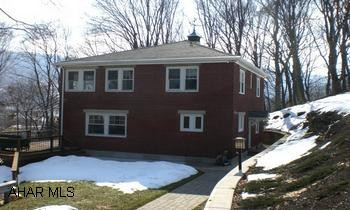 Elegant brick home nestled in Juliana Heights w/ absolutely gorgeous views. Paver driveway and 1 car detached garage. Stellar quality home on Juliana Street w/ privacy. Elegant brick home nestled in Juliana Heights w/ absolutely gorgeous views. Paver driveway and 1 car detached garage. Home offers a kitchen w/ top-tier built-in appliances, quartz counter tops, ceramic tile floor w/ radiant heat, a den w/ built-in mini refrigerator, built-in book cabinets w/ glass fronts, hardwood floors, a LR w/ gas log f/p, open wall DR w/ hardwood floors, a MBR suite w/ sitting window. MBA has ceramic tile floors and walls, claw foot tub, ceramic tile walk-in shower w/ glass door. Stellar quality home w/ privacy!