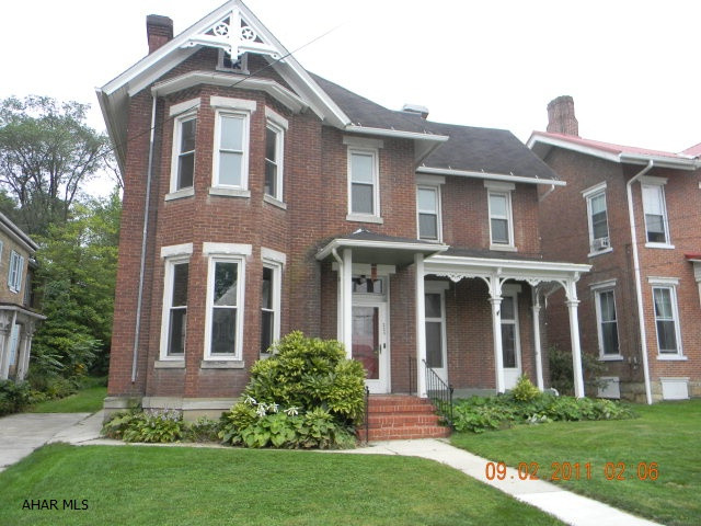 Roomy brick victorian in the historic Bedford Borough.  Lots of character with several fireplaces, french doors and an open staircase in the foyer.  The main level of the home offers a living room, dining room, kitchen, a den/office and full bath.  The second level has four bedrooms, a laundry area and full bath.  The third level is a finished attic with a bonus room.  One-car detached garage, full basement, oil hot water heat, kitchen skylights, shingle roof and mostly thermo pane windows.  Good brick construction.