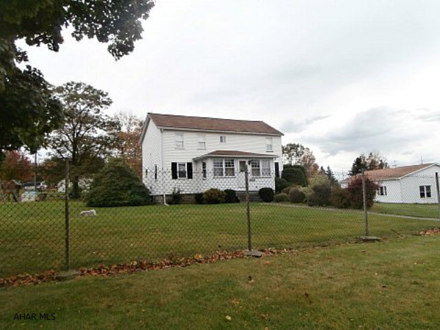 Well cared for 2 story 4 bedroom home. Property features 2 three car detached garages and paved drive.