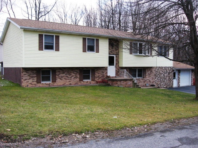 Oversized 4 bed, 2 bath bi-level on a quiet dead end street. Spacious kitchen with breakfast bar and informal dining rm. Large lower level with multi-rms. Oversized 1 car garage with loft storage.  Private wooded lot. New OHW 2 zoned heat w/central air. Additional lot included (across the street) 42x124.  Fenced yard. Logan Twp.