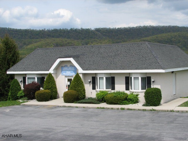 Over 2500 sq. ft. of space! Waiting room, 4 half baths, kitchenette, office, many exam rooms. Full unfinished basement, paved parking. Restrictions on file w/agent. Must stay as a medical related business.