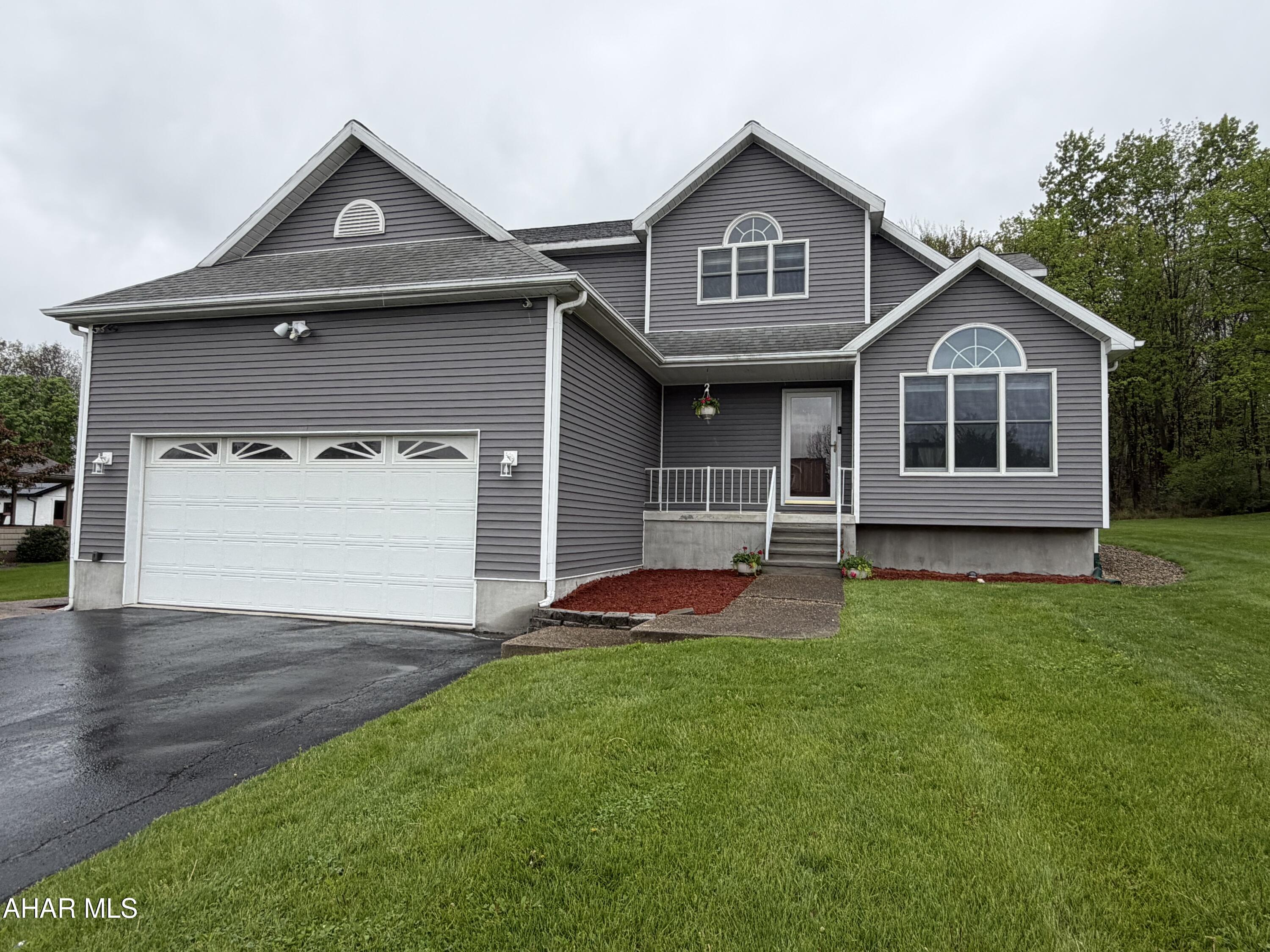 No need to look any further, you can simply pack your stuff and move into this beautiful 3 bedroom, 2 full, 2 half bath home.  You will love the peace and privacy this home offers on this quiet Altoona street.  Enjoy the multiple areas to relax inside such as the living room with a vaulted ceiling and tons of natural light, the family room next to the eat-in kitchen or the downstairs entertainment area. The convenience of the second floor laundry right outside the master en-suite is another reason you will want this home to be YOUR home.  For those times you want to be relaxing outdoors just hop into your own heated inground pool surrounded by a concrete patio and cozy gazebo. Other pluses include the oversized two car garage with access to basement, main floor of house or the backyard. The finished basement with a family room, office and storage add to the list of what will make you fall in love with your next home.