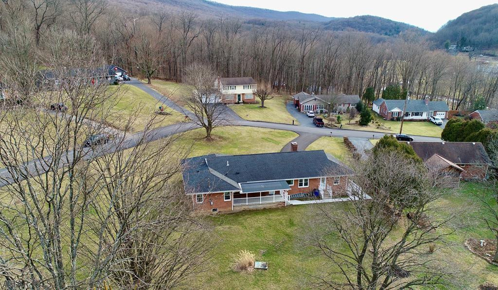 This hard to find 3 bedroom brick rancher, located in Meadowbrook, one of the most desirable neighborhoods in Bedford County is sure to please the most discriminating buyer.   It's close proximity to schools and town makes it an ideal location.  This home will impress with its many upgrades that include new multi zone boiler, new heat pump, new windows and renovated covered porch to name a few.    Spaciousness with tons of natural lights are words that best describe this outstanding home.  An oversized double lot completes this amazing home.