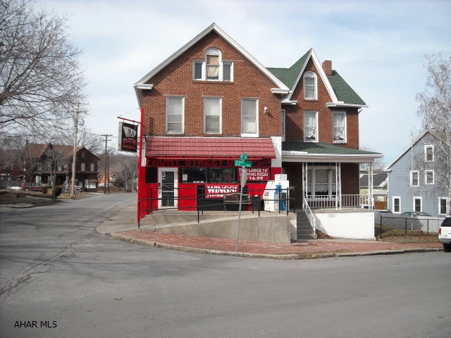 Very well cared for Commercial Property! Brick combination with three units! One leased commercial unit, one 2BR apartment, and one 2-3 BR house attached. Separate electric (3). Presently a restaurant in the leased space, apartment is rented, and home is occupied. Corner lot! 2-zone gas hw heat, approx. $160/mo., water & sewage approx. $165/mo. Some equipment is included with the restaurant. Newer roof (2005) with 30 year shingles, copper plumbing with pvc/cast drains, breaker boxes, good parking. Non-disclosure for income. May need delayed possession. No Sign on property.