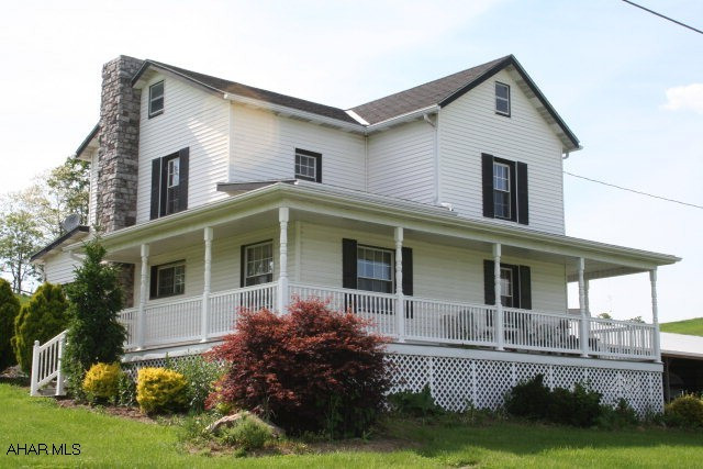 Updated two story with wraparound porch on quiet country road. Location overlooking golf course in progress. Vinyl siding and porch railing, new windows, 200 amp breakers. You have to see it to believe it!  To be connected bo public sewer.