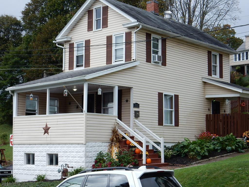 Charming 2 bedroom, 1 bath home in Ebensburg, This home offers updated eat-in kitchen with a pantry cupboard, hardwood floors downstairs, off street parking, Fenced yard, patio, covered front porch, covered back porch, low taxes, a garden, lots of perennials and additional parking in the back. Additional storage room under the front porch and Attic storage