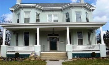 STATELY STUCCO & FRAME 2 STORY WITH DETACHED CARRIAGE HOUSE, LOCATED IN CHARMING HISTORIC NEIGHBORHOOD. GREAT POSSIBILITIES! HOME WARRANTY STATELY STUCCO & FRAME 2-STORY, LARGE BAY WINDOWS, 4/5 BEDROOMS, 3.5 BATHS, NEW KITCHEN & APPLIANCES, FIRST FLOOR BEDROOM/LIBRARY W/BATH, TWO FIREPLACES, LAUNDRY ON FIRST FLOOR, CERAMIC TILE, HARDWOOD FLOORS, PRIVATE PATIO, 2 COVERED PORCHES, FENCED YARD, LARGE DETACHED CARRIAGE HOUSE W/MAHOGANY CEILING AND POSSIBLE STUDIO/OFFICE/RENTAL UNIT ABOVE. BEAUTIFUL HISTORIC STREET, STROLL TO STORES, LIBRARY AND CHURCHES. TRULY UNIQUE GRAND DAME, WITH ENDLESS POSSIBILITIES. HOME WARRANTYCALL TODAY....GAIL CORLE 932-3231.