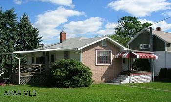 ONE STORY CORNER PROPERTY. COZY ONE STORY ON CORNER LOT. COVERED PORCHES. 2 BR, 1 BA. NEWER OAK KITCHEN, NEW FURNACE.