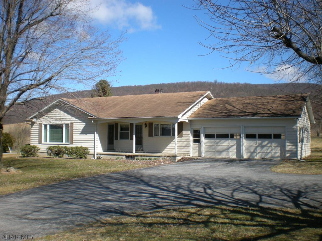 Well built 1 story rancher with 3 Bedrooms, 1.5 Bathrooms, 2 car attached garage on a level 1.31 acre lot with fantastic rural views, conveniently located within a short distance to Spring Cove Elementary School, State Game lands, shopping, convenience stores and food establishments.