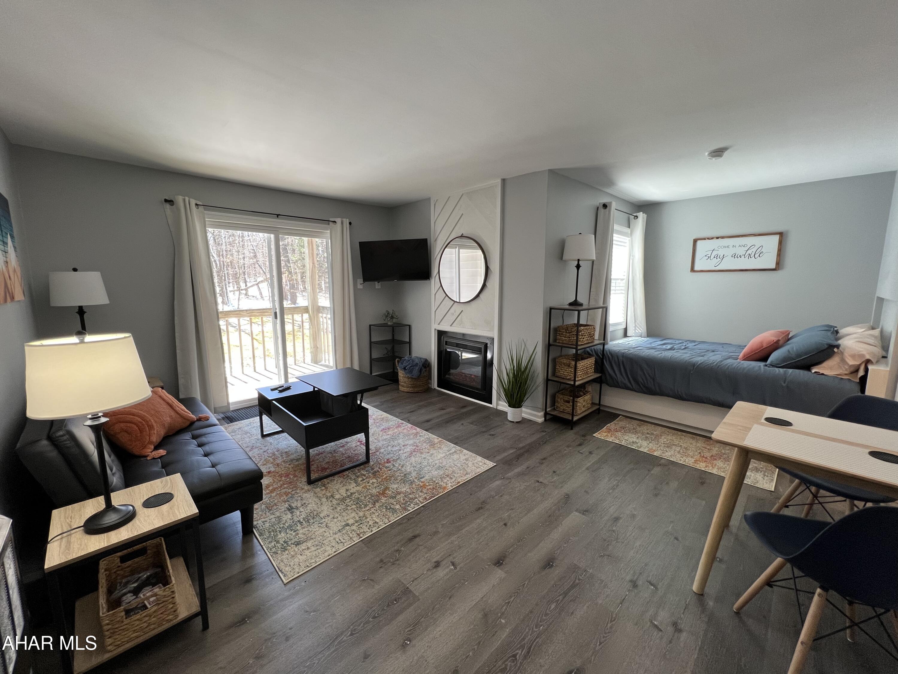 Turnkey 2nd floor studio in the Allegheny Mountains at Blue Knob All Seasons Resort has everything you need. Completely remodeled and fully furnished. New kitchen cabinets countertops, windows, sliding door, flooring and appliances. Cuddle up next to the fireplace while enjoying the view from the siding doors. The feature wall brings a warm and inviting feel. Walking distance to indoor pool/hot tub, outdoor pool and The Club House Bar & Grille. Blue Knob is the 2nd highest mountain and highest skiable mountain in Pennsylvania! In addition to an array of winter activities, Blue Knob also has a full-service all seasons Conference Center for weddings and events, they also offer golf, swimming and multitude of trails for hiking, running, and mountain biking. Visit https://blueknob.com/activities-events/ to see all the fun events that are happening at Blue Knob. $290.00/ Mo HOA fee includes: pools, hot tub and gym area, tennis and pickle ball courts, building, property maintenance & garbage.  *Conference center, Golf and Ski resort is not included in HOA fee. *