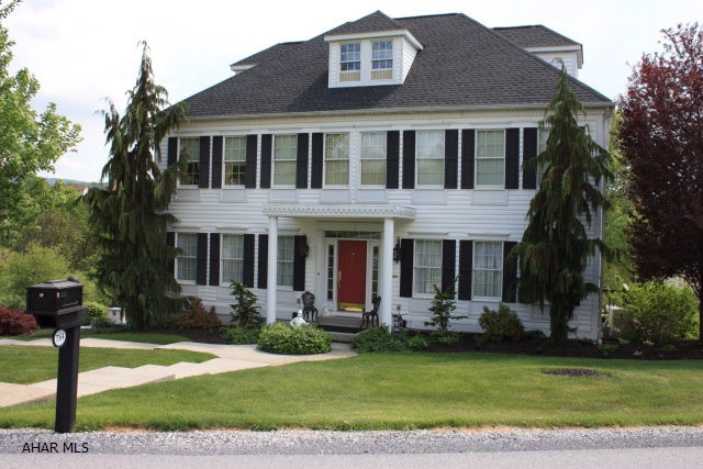 Impeccable 4 bedroom 3.5 bath home with space galore on large .44 acre double lot.  Enjoy the beautiful views from the deck featuring a full awning.  This is a full 2 story home with an attic walk up with tons of storage.  Full master suite with master bath and walk in closet.  Hardwood floors accent the home which has lots of living space.  Formal dining room, full living room and large den.  Lots of windows throughout.  Storage abounds - and the home has been so well maintained.  Don't miss the opportunity to own this large, move in ready home.