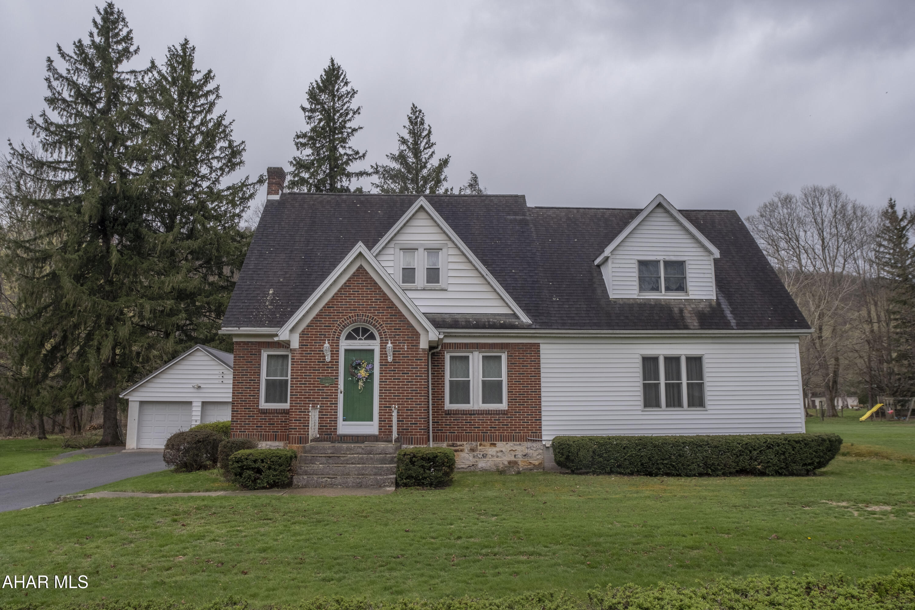 This beautifully maintained one-and-a-half story home sits on 1.14 acres and offers an exceptional blend of space, comfort, and charm. With three bedrooms and multiple living areas, there's room for everyone to relax and enjoy.

Upstairs, you'll find 3 bedrooms with a spacious primary bedroom complete with a private master bath and an additional half bath for added convenience. The main floor features a thoughtful layout with a formal dining room, a welcoming living room, a second cozy living area, a full bath, a large den and a well-equipped kitchen. A dedicated laundry room and an attached two-car garage add to the home's everyday functionality.

Immaculately kept, this home showcases a mix of hardwood, tile, and carpet flooring throughout, giving each space its own distinct feel while maintaining a cohesive style. Step outside and enjoy the serenity of the expansive lot with a covered back porch perfect for outdoor entertaining, gardening, or simply soaking up the peaceful surroundings. Schedule your tour.