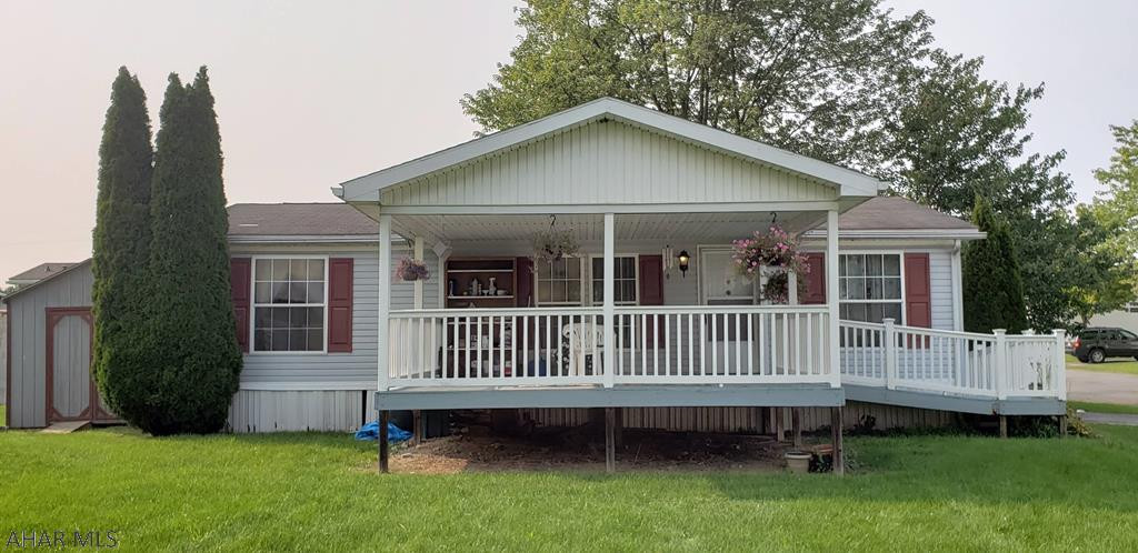 Lovely 1-story home in Stone Manor Mobile Home Park.  This home is on a beautiful large, level lot.  Spacious 16' X 16' covered porch.  Vaulted ceilings throughout.  All carpet is new.  Convenient laundry area adjacent to the kitchen.  Home is ready to for you to move in and enjoy!  Lot rent is $290/month.