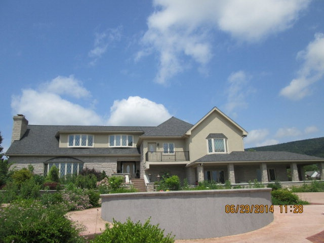 This magnificient estate has a view of Canoe Creek Lake and is very private. There is a fabulous outside entertainment area that is resort style. A pool house with living quarters. The interior boasts a media room and a two zone wine cellar.  This is a multi level home each having its own purpose. All cabinetry was custom made and beautiful granite. There is a bar, pool table and family room level that goes out onto the front acreage with a view. There is a state of the art security system that lets you run the home from the palm of your hand. Really must see if you are in the market for a Superior Lifestyle Home.