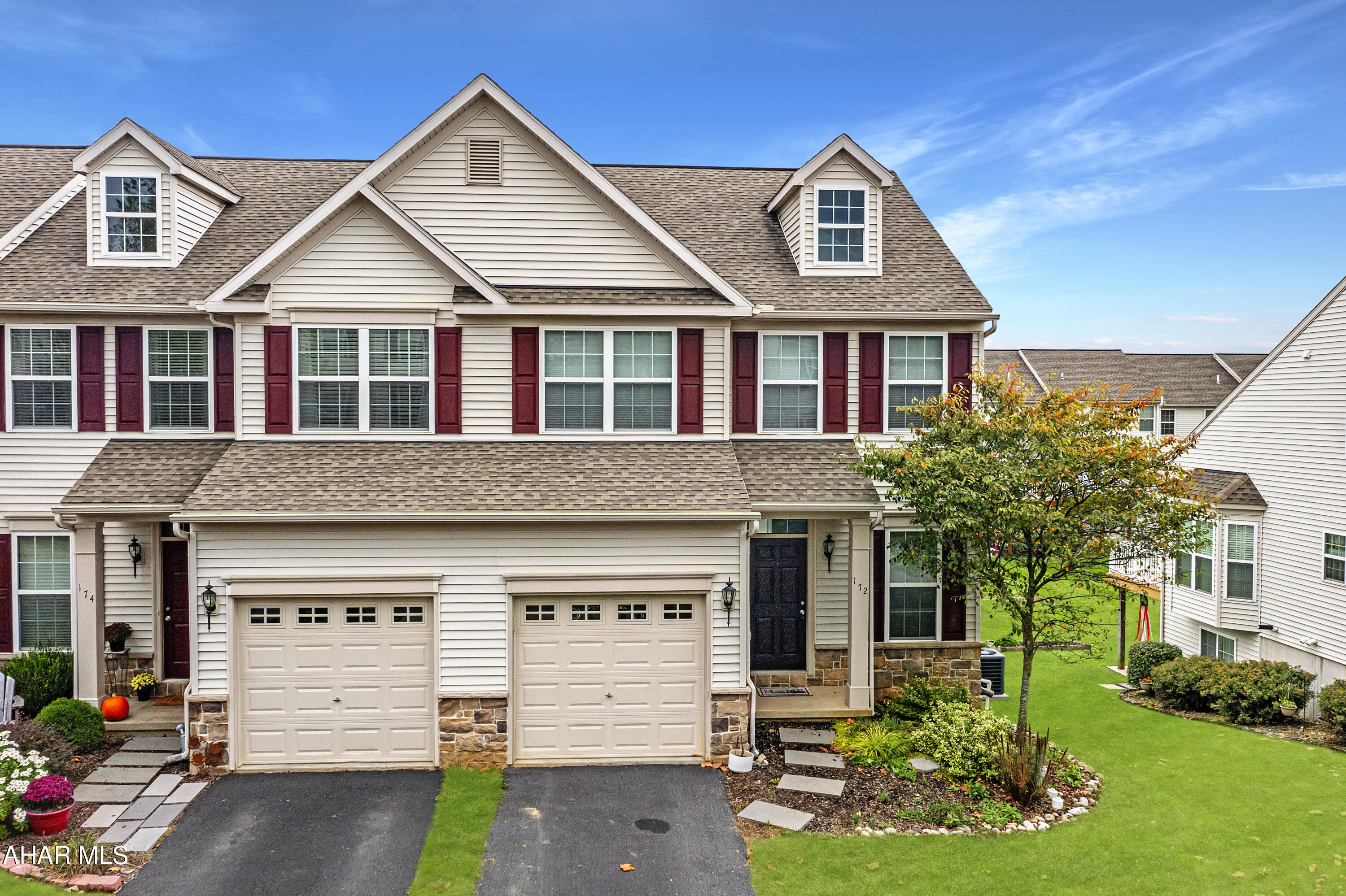 Check out this beautiful 2 story town home in Amberleigh! It's an end unit with a one car garage and an open floor plan. Enjoy plenty of space with 3 bedrooms, 2 full baths and one half bath. The large eat in kitchen has an oversized island, perfect for preparing meals. You also have a nice sized pantry closet and if you enjoy barbeques or eating al fresco, the back deck is just steps away through sliding glass doors. The family room is light and bright and flows into the dining area. Upstairs you'll find a spacious primary suite with cathedral ceilings, a walk in closet and a full bath. There's also a convenient laundry room on the second floor. Downstairs, you have even more space with a fully finished walk out basement!
