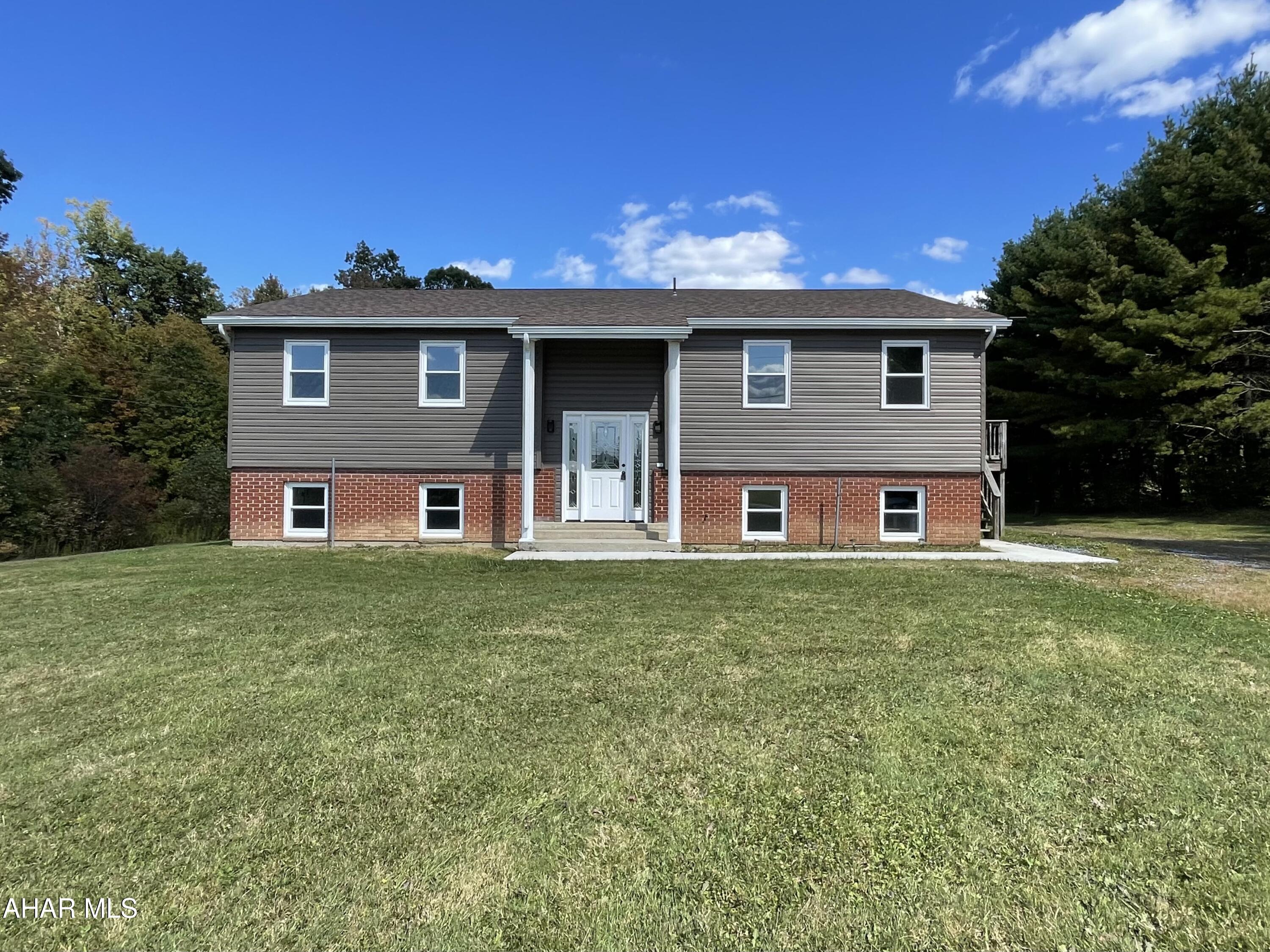 This is a very unique investment property due to size of lot, quality of work and endless possibilities with location.  This 4 unit apartment building sitting in the country side has been completely gutted and renovated. Newer roof, windows, doors, floors, walls, kitchens and bathrooms, lighting throughout.  It doesn't stop there though as there are additional connections on site from an old trailer that was removed for another possible building. With over 2 acres you could possibly place storage units on the lot to maximize your investment.  Top two units are completed. Bottom 2 units have materials for completion and will be done before closing. Also making this property unique is that it is well and septic.  No water bills to think about.  Run don't walk to this one of a kind property. Buyer to verify all measurements.