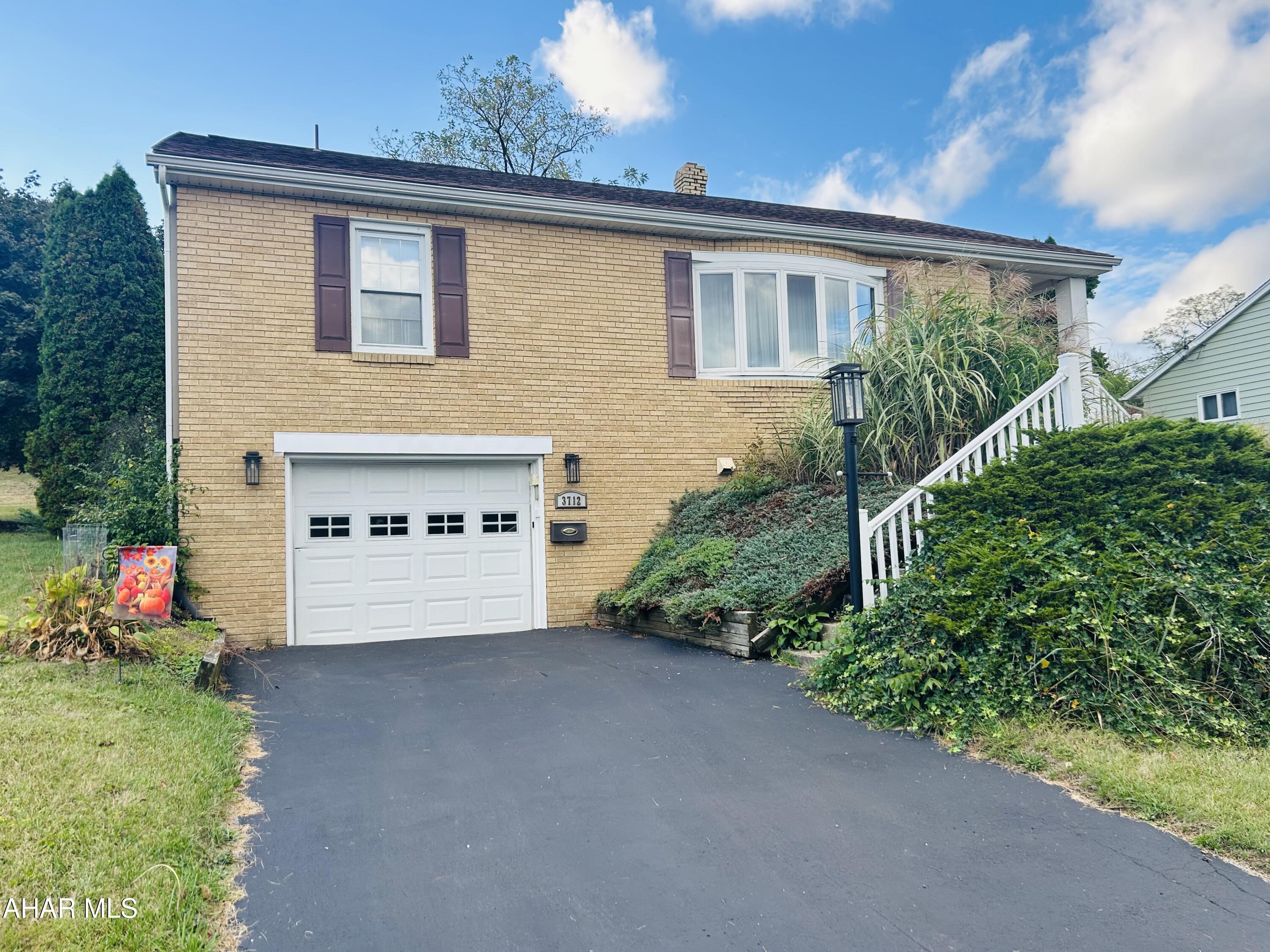 Welcome to 3712 West Chestnut Avenue. This brick and vinyl sided 3 bedroom, 1.5 bathroom family home is larger than it looks!  Thoughtfully maintained offering comfort and convenience.  This home is move in ready and located on a school bus route, making school days a breeze.

Natural light fills every room from the large bow window in the living room to the 2 windows in each of the bedrooms and the new window in the updated family bathroom, just completed in 2025.

You will find storage galore from the bedroom closets, the custom cabinets in the family bathroom to the updated kitchen featuring 2 pantry closets, oak cabinets and sleek stainless steel appliances.

On the lower level you will find a spacious family room. handy half bath, drop zone for coats, shoes and boots off the large one car integral garage.  There is also a laundry area with washer and dryer.

Peace of mind comes from the newer roof installed in 2023.  Outside there is a large, relaxing concrete covered patio to enjoy a cup of coffee or dine alfresco.  A storage shed completes the tranquil large backyard.

Make this home yours today!