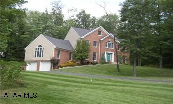 CUSTOM BUILT 4-5 BEDROOM ON 1.9 ACRES.  THIS UNIQUE ESTATE OFFERS A PRIVATE WOODED SETTING, VAULTED CEILINGS THROUGHOUT, HARDWOOD AND CERAMIC FLOORING.  GOURMET EAT-IN KITCHEN WITH ISLAND STEPS INTO A BRIGHT, VAULTED FAMILY ROOM WITH GAS FIREPLACE, SKYLIGHTS AND BUILT-INS.  MASTER BEDROOM WITH HUGE WALK-IN CLOSET AND FULL BATH WITH JACUZZI AND SEPARATE SHOWER.  OTHER FEATURES INCLUDE A WORKOUT ROOM, WORKSHOP, CENTRAL VAC AND SO MUCH MORE!!