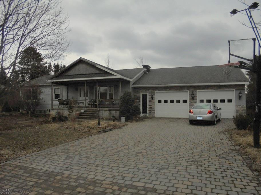 3 BR 1 3/4 bath ranch style home. Gas hot water BB heat.  2 car attached garage.