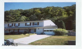 Originally 3 BR-could reinstall wall for 3rd BR.  Great family room off kitchen 16x18 w/skylight - covered patio - must see!!  Woods off backyard.