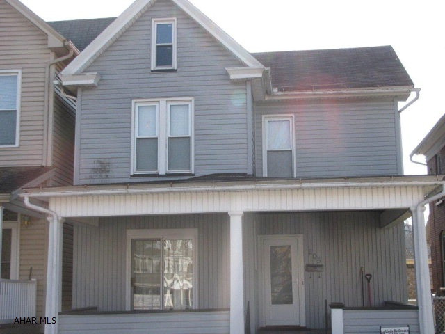Adorable 2 1/2 story vinyl sided Tyrone home! Includes 3 bedrooms and 2 full baths! Modern oak kitchen w/ ceramic tile floor ! Entertain inside with the large wet bar or outside on the large covered deck! Hardwood floors, fenced yard, large covered front porch and updated bath! Sellers including a $1500 flooring allowance for buyers too!