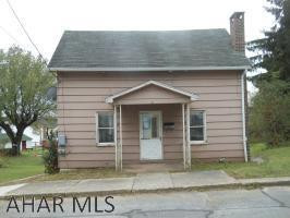 This property is subject to a 5% buyer's premium pursuant to the Auction Terms & Conditions (minimums may apply). Please contact the listing agent for commission and details. This is a reserve auction and all offers are subject to seller approval. Please contact listin This is a two story home located in Gallitzin, within Cambria County. This is a home with a nice lot and an off street parking space. The first floor features a living room, family room, kitchen, full bath and an office/den with access to the exterior. The second floor features a bedroom and a captive room with closet space. There is gas service in Gallitzin, this house is not hooked up. It currently uses oil for heat. City water and sewer. Located on a secluded street. With some custom touches, this house could be your home
