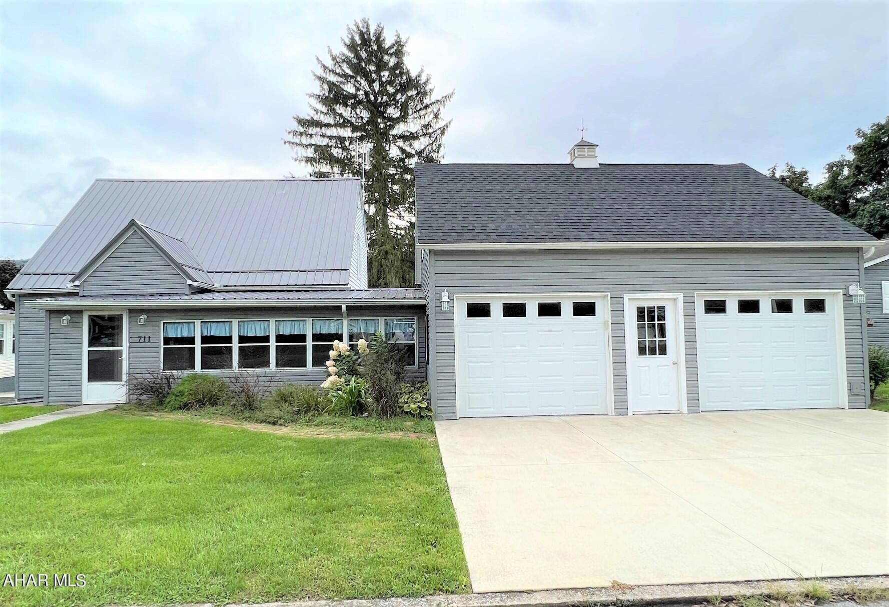 Charming cape code home situated just blocks from historical downtown Bedford and less than one mile from the Omni Bedford Springs Resort. The main level features an entry foyer, living room, kitchen, dining room, bedroom, a full bath and laundry room. Second level has two bedrooms and another full bath. Large front sunroom for relaxing and rear enclosed screen porch. Two-car attached garage with full second level loft for a workshop or storage. Full basement with integral garage, combination furnace of either oil, wood or coal, mini split heat pumps with air conditioning and updated 200-amp electric. Great location and move-in ready!!