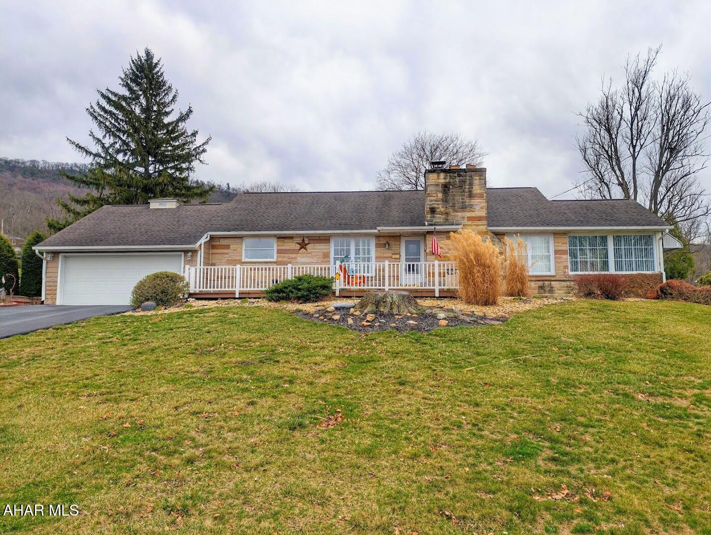 Welcome to this charming 3-bedroom, 1½-bath home situated on a beautifully maintained 0.39-acre lot. This home has been well loved and offers warmth and character throughout.

Inside, you'll find hardwood floors and a beautiful fireplace that creates a cozy focal point in the living space. The living room and dining room feature large windows that fill the home with natural light, creating a bright and welcoming atmosphere throughout.

One of the most unique features of this home is the two inviting sunrooms, perfect for enjoying morning coffee, relaxing with a book, or simply soaking in the natural light year-round.

The partially finished basement includes an additional full bathroom and offers great potential for expanded living space, a recreation room, home office, or guest area with just a little finishing work.

Additional features include a 2-car garage and a spacious 0.39-acre lot, providing plenty of room for outdoor enjoyment, gardening, or entertaining.

A home full of character, light, and opportunity--schedule your showing today and see all it has to offer.
