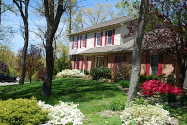 Beautiful two story in Sylvan East.  Large rooms - 3000 sq. ft.  Hardwood and Ceramic Tile floors.  First floor family rm w/wood burning FP and cathedral ceiling.  3 season sun porch.  Large corner lot with gorgeous landscaping.