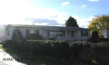 Double wide on foundation. 2 car detached garage 9 year old double wide on foundation with lovely front and back porch. Two car detached garage.Nice yard.