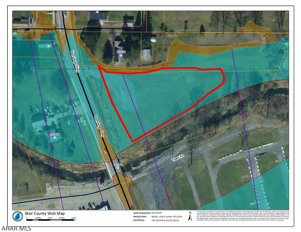 Busy commercial corridor beside the flea market and across from the farm market in Newry. 2.3 Acres with over 1 acre now out of the flood zone. We obtained a letter of map amendment (LOMA) so that you have buildable area outside of the flood zone. See attached map.