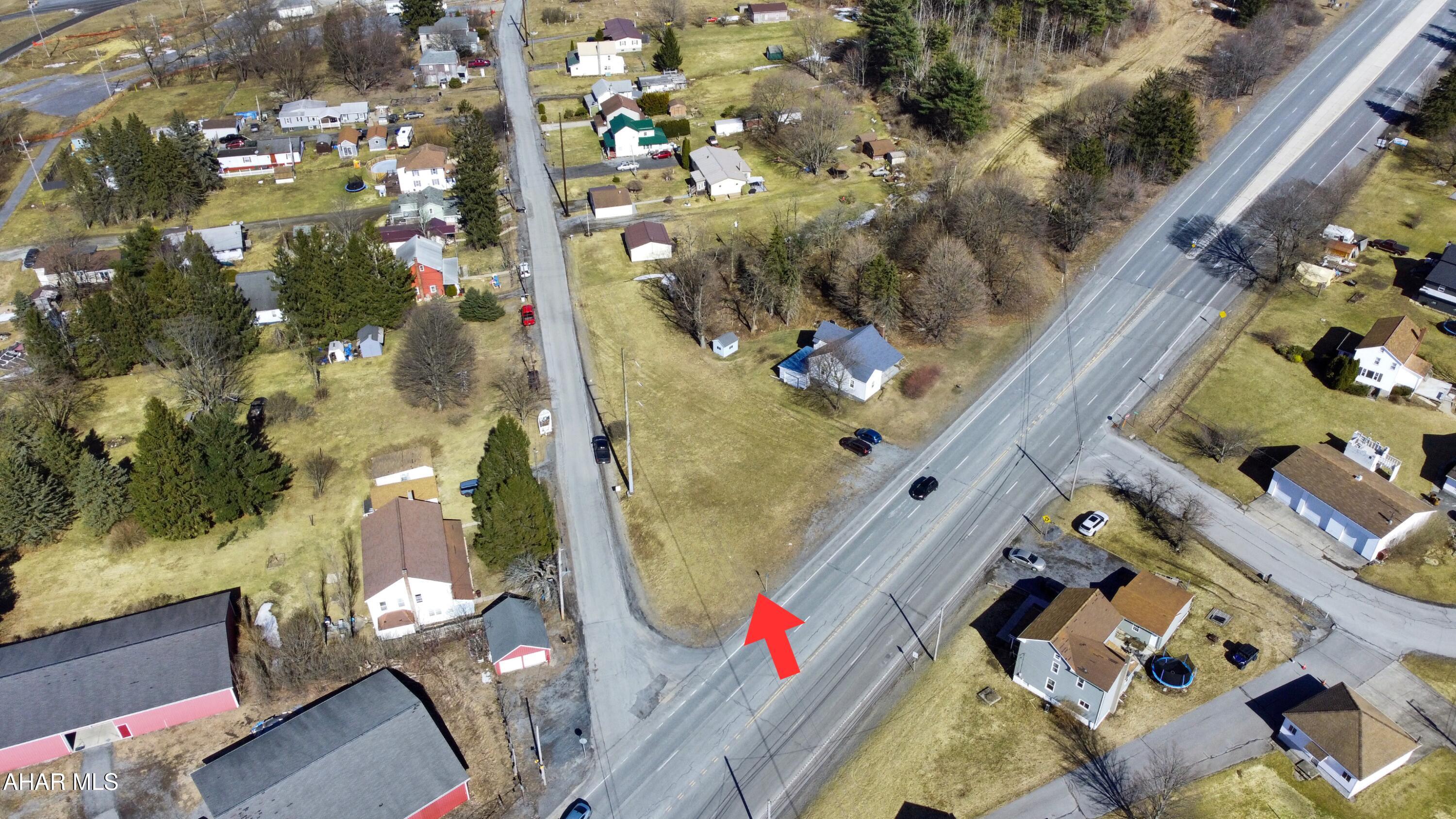 Discover this prime commercial property offering approximately 0.46 acres with 155 feet of highway frontage along the Admiral Peary Highway in Cresson. Situated on a corner lot, this valuable location is just 0.15 miles from the high-traffic Route 22 interchange, which sees an estimated 25,000 vehicles daily. This unique site is ideal for various uses, including storage units, fast-service businesses, or any venture you envision. While public utilities are believed to be available at the street, potential buyers should verify their presence. Don't miss out on this incredible opportunity—call today!