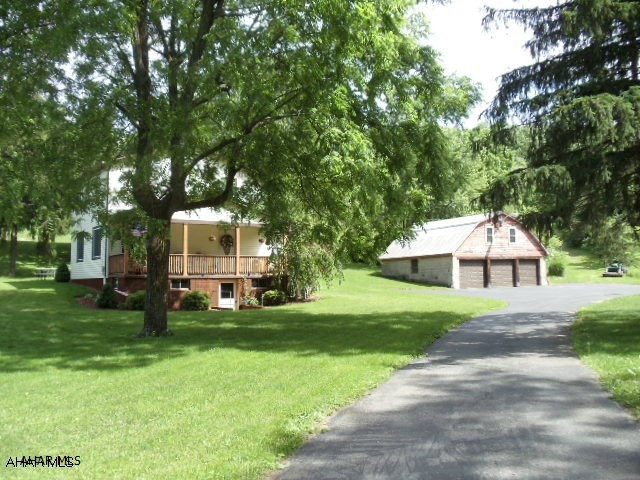 Nice vinyl-sided 3 bedroom, 2 bath home with modern eat-in kitchen, 3 car garage on 3.125 acres. Garage now has new vinyl windows, vinyl siding, sofit and fascia. Also the small shed has new vinyl siding, sofit, fascia and new roof. Old property address was 127 Singer Lane. Estimated 2017 tax assessment $1714.14 (Would have been $2622 with 13.7 acres, however 3.125 acres being sold with this parcel). Buyer must confirm with Blair County Assessment Office.  #J-243