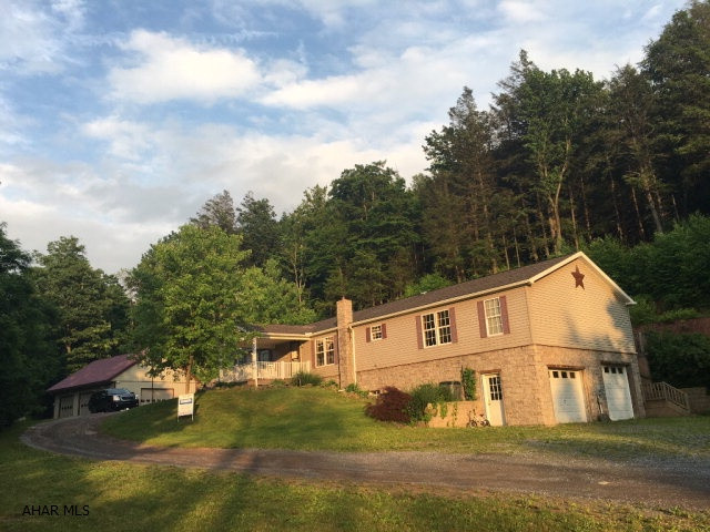 Very quiet & peaceful setting on 31.36 acres in HLBG SD. This home offers 4 bedrooms on 1st floor- 3 of the bedrooms, a full bath, laundry area are off the kitchen. Great room with fireplace with sliders out to large deck in back of home. Master suite with sitting area and full bath with a double sink, shower, large soaking tub. Finished basement has Family room with a coal stove that could easily be a Mother-in-law suite with 2 finshed bonus rooms. 2 car Integral garage. The 30'x40' detached garage w/12' ceilings-3 10' overhead doors and a loft for addition storage.