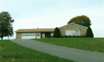 Much desired stone ranch home in Breezewood, very nice location. Close to Route 70 or PA Turnpike. Well built stone ranch home in Breezewood. Has a lovely yard with a very nice view. Paved drive and easy care landscaping. Home has three sources of heat and central air. Roof is 7 years old. Great home for one level living.
