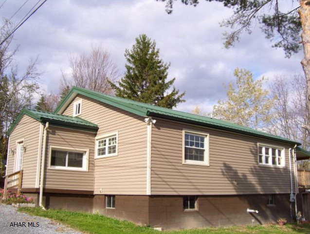 Tons of charm with this well maintained home on 1 acre. Nice closet space in the spacious bedrooms. Most everything in home 2 years old. Shed, pellet stove, fireplace and all appliances included. Qualifies for Rural Housing loan.