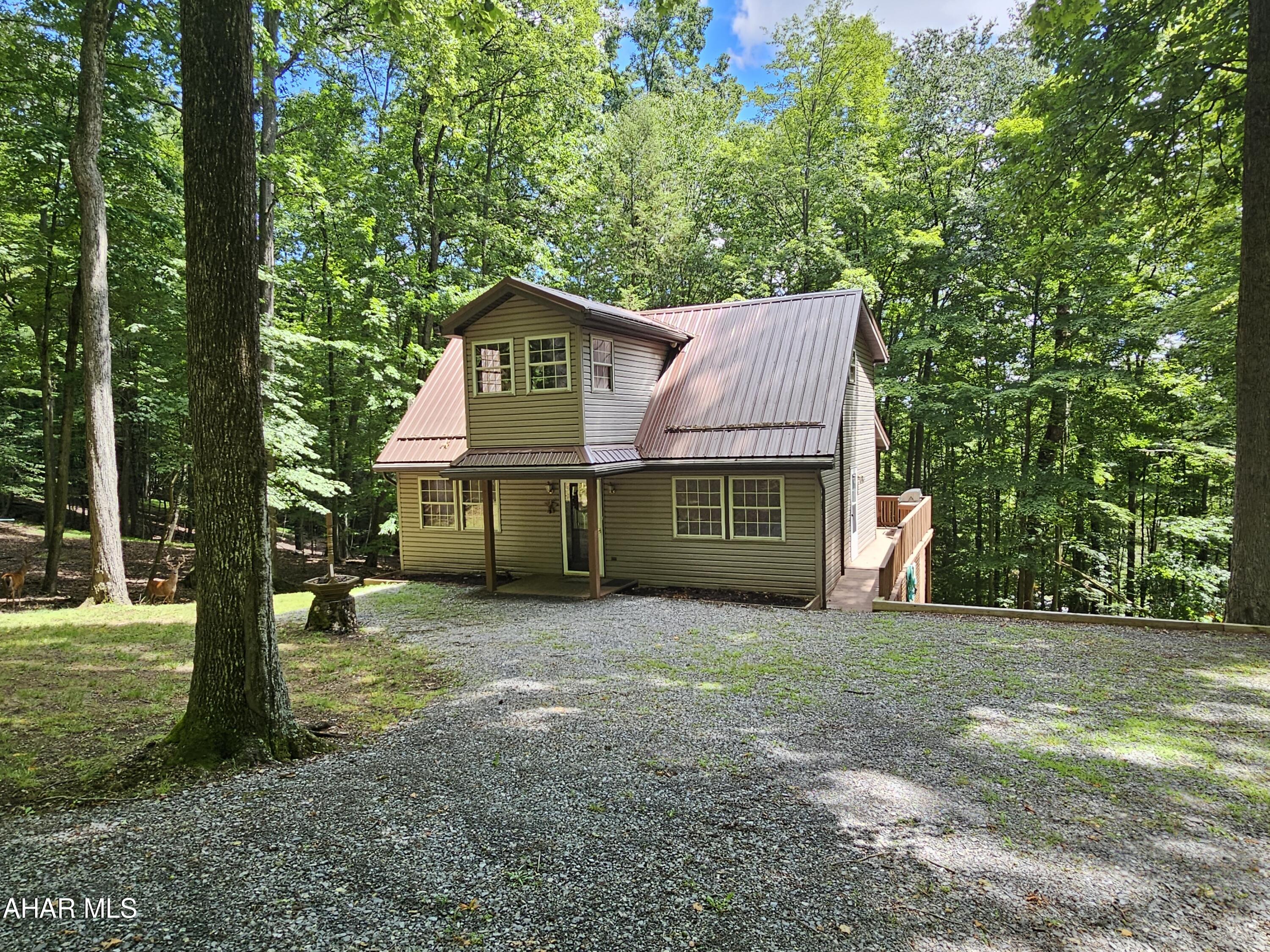 3 bedroom and 2 bathroom cabin on 1 acre(2 lots) inside Glendale Yearound. This is your beautiful cabin in the woods. Perfect for weekend getaways or even a full time residence. Comes fully furnished!!! Bathroom on every level. Half of the basement is finished. Unique private space on the 2nd floor. Glendale Yearound is a gated community located minutes from Glendale Lake and Prince Gallitzin State Park.