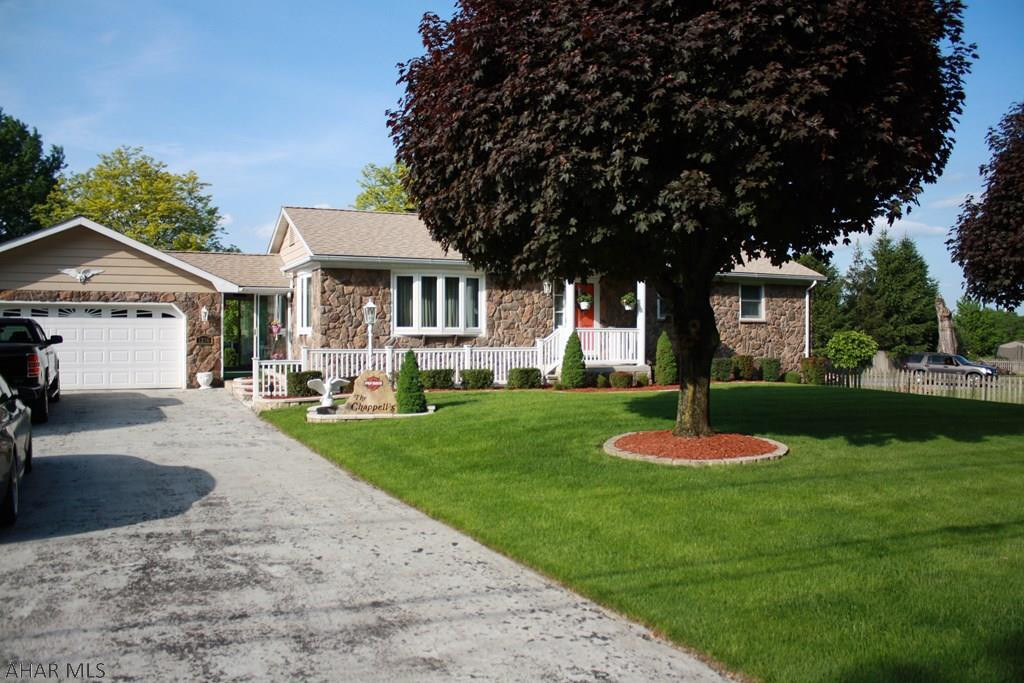Meticulously cared for rancher in the Hollidaysburg School District.  There are so many features of this move in ready home.  There is a central Vacuum, spacious finished family room in the basement with wood and coal burning stove to save on heat bills.  There is a full bath and 2 half baths along with a separate shower.  There is a workshop in the basement and a spacious 2 car garage with storage above.  Recently remodeled oak kitchen which includes tons of storage and matching barstools are included.  All appliances are included.  Did we say move in ready?  Enjoy country living while you are close to local amenities.  This house is also in a USDA area for financing.  35 year shingled roof and new zoned heaters throughout.