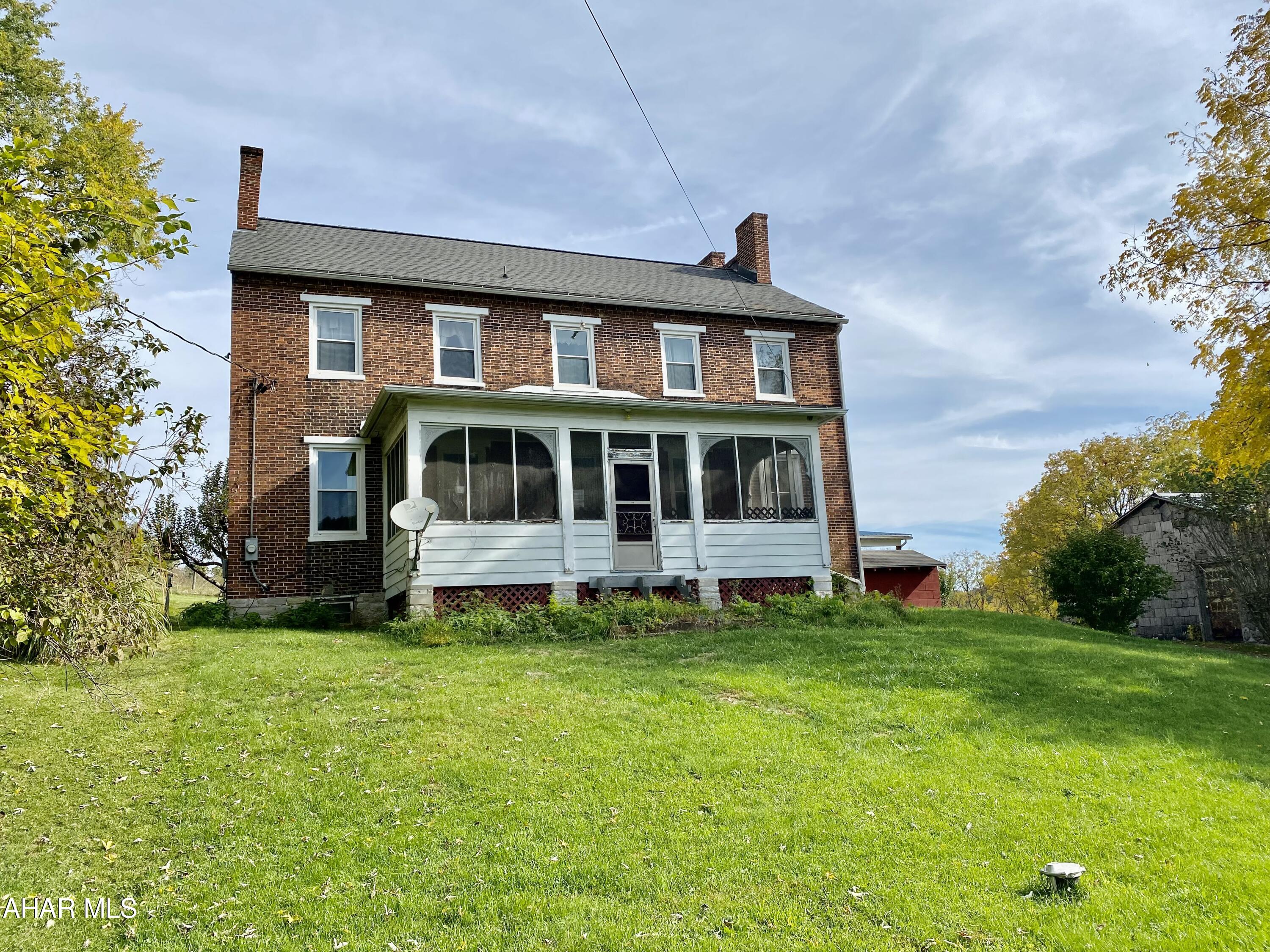 Farmettes don't come along everyday. Here's your opportunity to call this one your very own. This beautiful farmette with large brick farmhouse sits on 12 acres in the Wesley Chapel area, within close proximity to State College, Huntingdon, Alexandria, and Altoona. There is a place for everyone with 4 bedrooms,spacious living areas, and a barn with four 12'x12' stalls to bring the goats, horses, rabbits, dogs, and cats-no one left behind. There is also a 36'x36' pole barn for storage of your toys, cars, or small animals, the choice is yours. Pole barn also boasts a 12-foot porch. There is a 100'x200' riding ring located on the property to enjoy country living to the fullest. The country farmhouse has that old farmhouse feel and provides a blank canvas for you to make it your own.