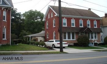 Totally remodeled interior.  Must see inside. Lots of charm.  Also has attached apartment for additional income.  Exterior lighting. concrete driveway, close to park. Carport/patio.  One car garage has walk up second floor for lots of storaage. Remodeled!  Great Charm.  Must see inside!  Close to park. Newer flooring, newer carpeting, new walls, new wiring, new plumbing. Convenient to banks, stores, restaurants.  Supplement your income with the one bedroom attached apartment! Carport/patio attached to house.  Garage has great walk up second story which is floored for plenty of storage.