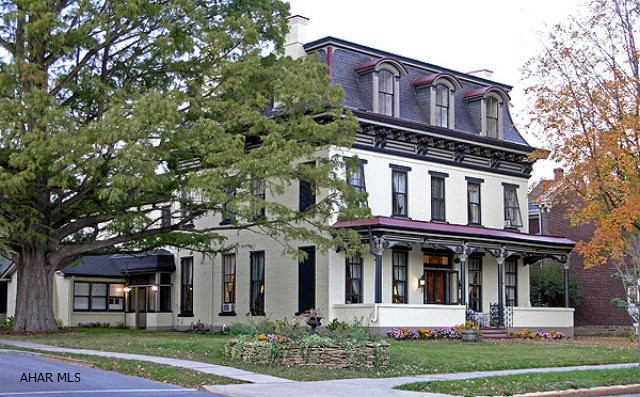 Magnificent Second Empire Style home located in the heart of downtown historic Hollidaysburg. There are 8-9 bedrooms, 9 bathrooms, 5 fireplaces, 43 custom window treatments, carriage house, 4 - car garage, picket fence and more. Seller requests that NO ONE contact her by phone or in person regarding the sale of her home, please. Qualified Buyers Only!  Call for details and data sheet.