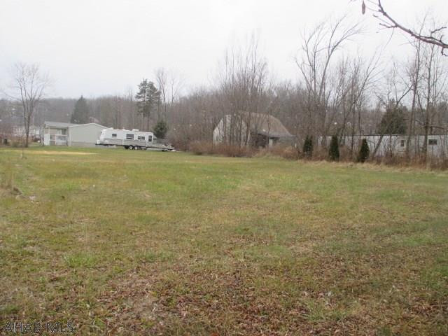 Why pay lot rent when you can own your own ground? Doublewides and modulars accepted! Bellwood school district. Large level lot. City water and city sewer on lot. Must pay to tap on.