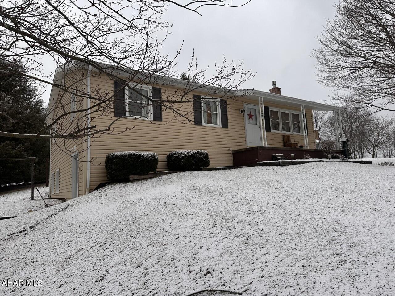 Central Cambria Schools -Jackson Township- 3 Bedroom, 1 3/4 Bath vinyl sided raised ranch home on approx. 1 acre.  Updated windows & roof.  Finished basement with family room, Laundry/bath, and kitchenette.  Propane stove included as well as all appliances.  Large rear deck.  2 Car detached garage.  A must see at $189,900.