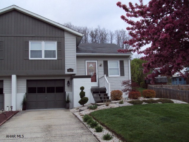 Nicely remodeled. Newer custom kitchen. Hardwood floors through living room hallway and both bedrooms. Finished room in lower level. Screened in rear patio. Tastefully landscaped.