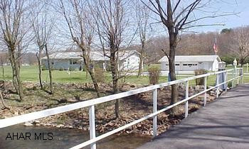 I-99 East Freedom exit, RT 36 S .6 miles, L @ McKee Electric onto ShMeticulous home with 2-tier deck, open floor plan, circular drive,  2 plus garage with workshop, with approx. 16 acres.  Bridge with pole light post overlooking Haltercreek. Listing J-861 I-99 East Freedom exit, RT 36 S .6 miles, L @ McKee Electric onto Shoenfelt, 2nd property on R over Bridge.Meticulous home with 2-tier deck, open floor plan, circular drive,  2 plus garage with workshop, with approx. 16 acres.  Bridge with pole light overlooking haltercreek.   Tax ID # 9-7A-13-2  9-7A-13B & 9-7-18   Listing J-861