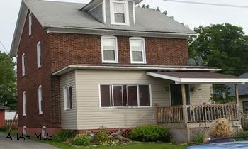 2 Story brick and vinyl - 1 car garage - Great location - Walking distance from town and school.