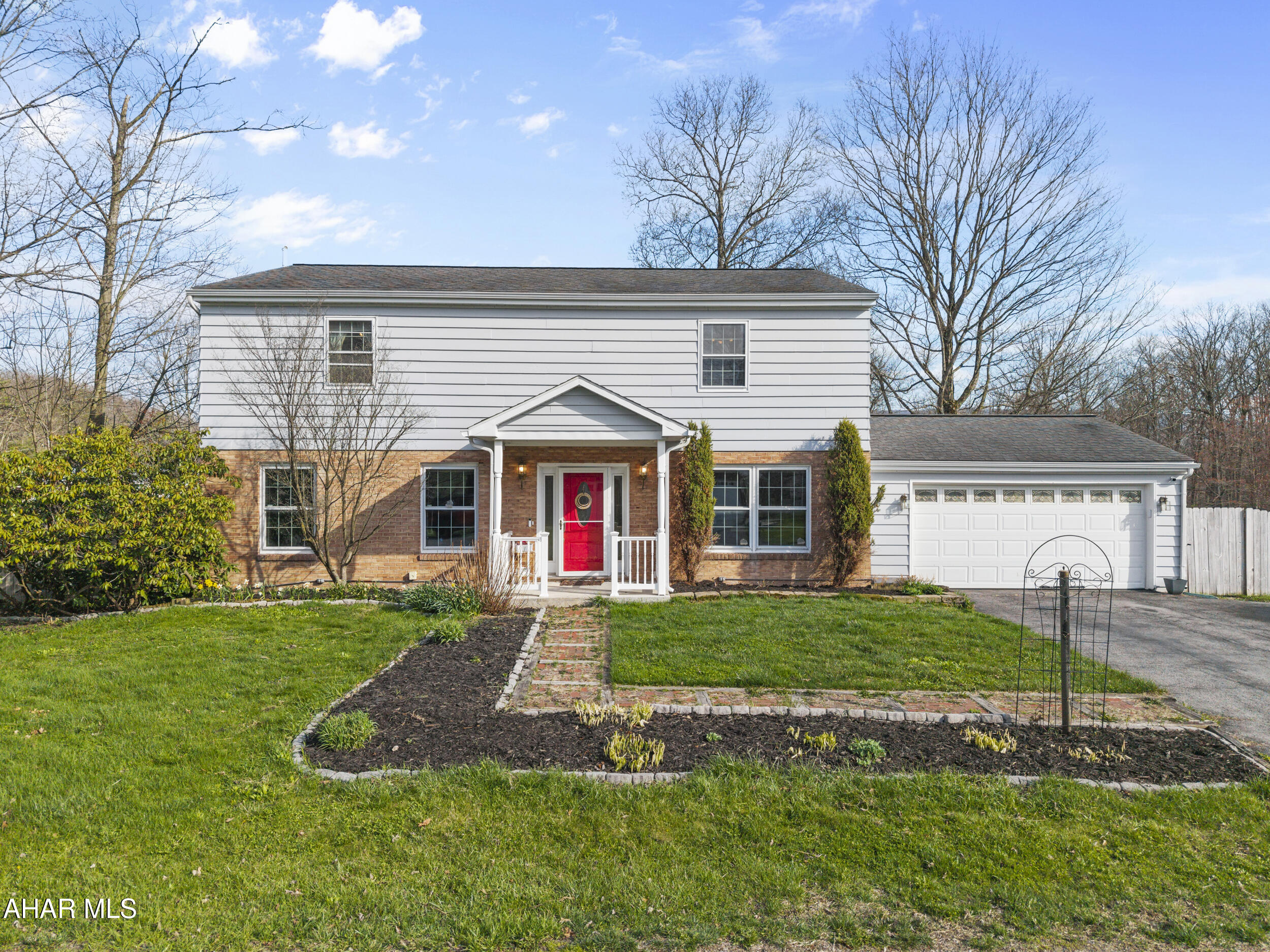 Step into timeless charm with this 4-bedroom, 2.5-bathroom residence offering 2,760 sq. ft. of thoughtfully crafted living space. Nestled in a quiet countryside location, this home embraces a traditional concept layout -- blending defined, cozy spaces with a warm and welcoming atmosphere.

An inviting living room featuring a gas fireplace, a separate dining room which is perfect for hosting family dinners and holiday gatherings. The spacious kitchen offers ample cabinetry, a center island with granite counter tops.

The primary suite provides a private retreat with ample closet space and a well-appointed ensuite bathroom. Three additional bedrooms offer comfort and flexibility for family, guests, or a home office.

A highlight of the home is the sun-filled enclosed patio, ideal for enjoying the beauty of every season without leaving the comfort of your home.

Set on a generous lot with mature trees and open space, this property offers the serenity of rural living while keeping you within easy reach of local conveniences.