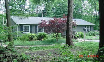 Beautiful lakefront setting on 3/4 acre w/ 3 Bedrooms, 3 Baths, 3,000 sq. ft. of living space.  Central Air, 2 FP, Wrap-around deck, screened porch, all the amenities of GY, just minutes from Prince Gallitzin State Park.  Beautifully landscaped Beautiful lakefront setting on 3/4 acre w/ 3 Bedrooms, 3 Baths, 3,000 sq. ft. living space, Central Air, 2 FP, Wrap-around deck over looking lake, screened porch, all the amenities of GY, minutes from Prince Gallitzin State Park.  Beautifully landscaped.